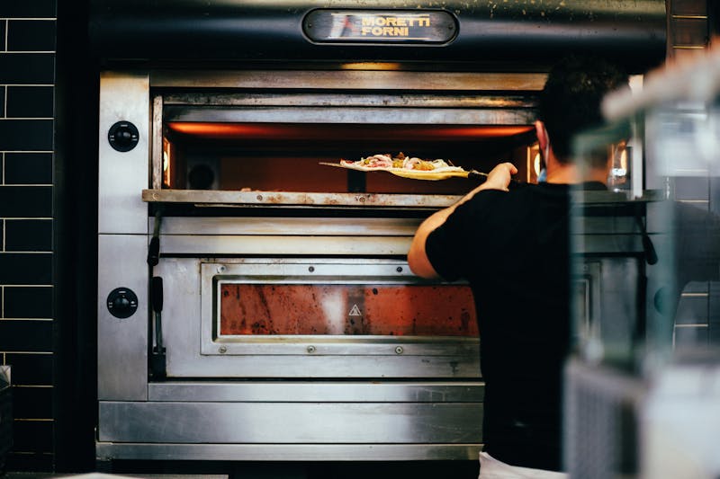 Green Lantern Pizza kitchen and fresh pizza preparation
