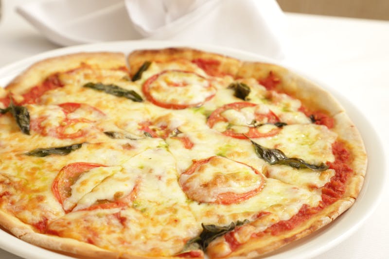 Green lantern pizza signature pepperoni pizza fresh from the oven