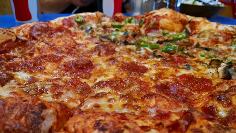 Smoky BBQ chicken pizza with melted cheese